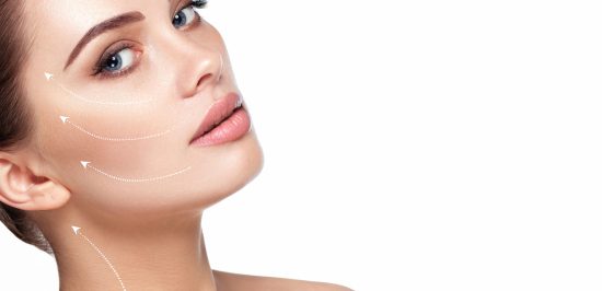 portrait of beautiful woman with perfect skin of the face, with arrows on face, concept of lifting skin. Cosmetology, elastic and young skin of the face.